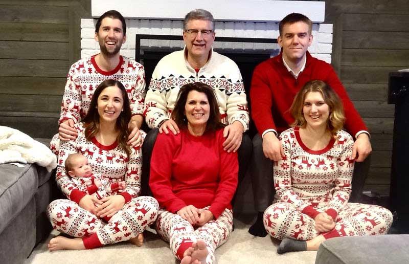 Jim Abraham with family in Christmas pajamas